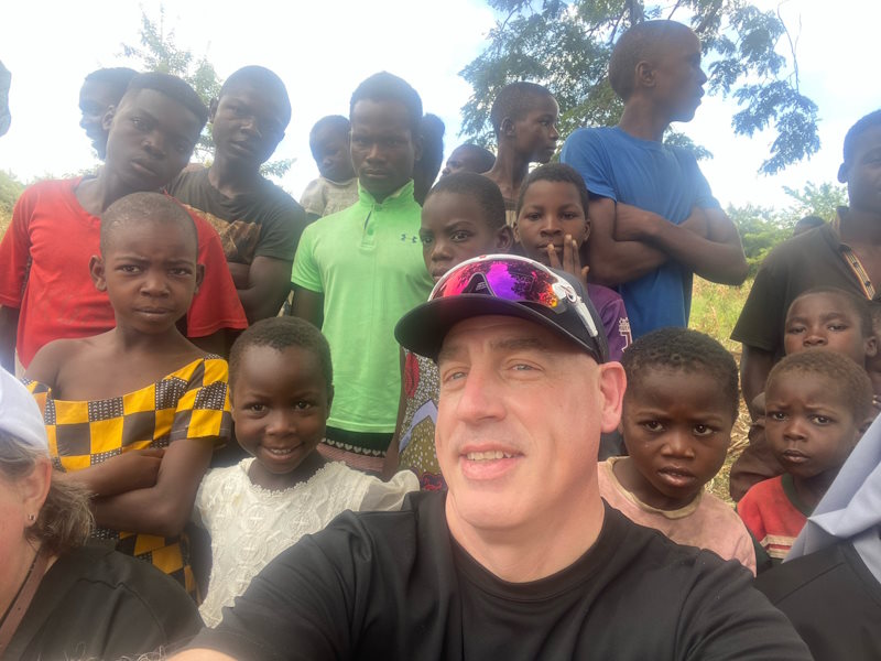 Scott with a large group of young children in Malawi.