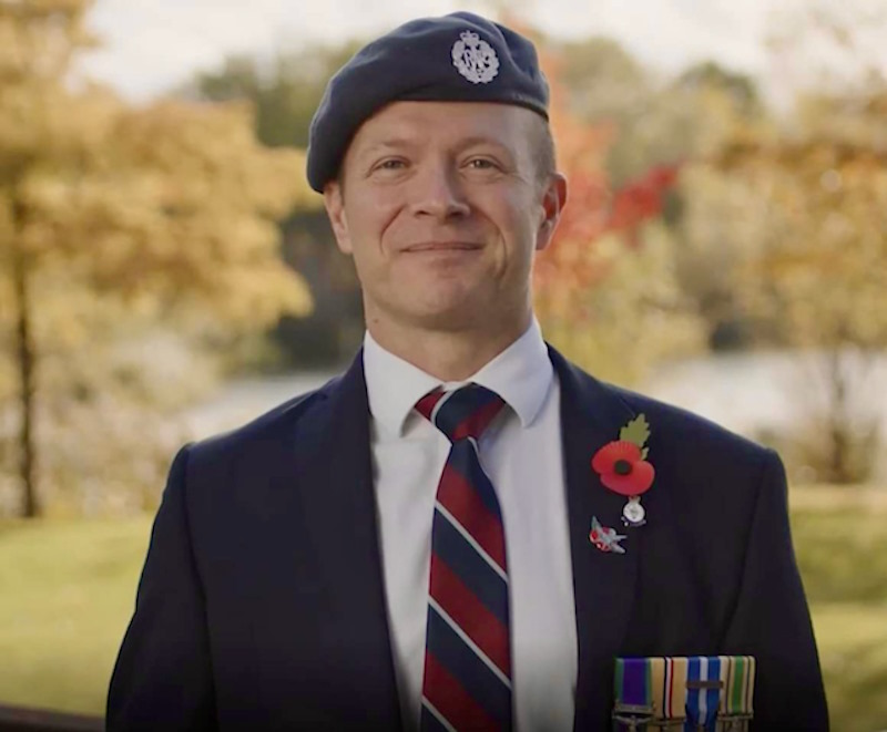 Mat wears Royal Air Force beret and badges. 