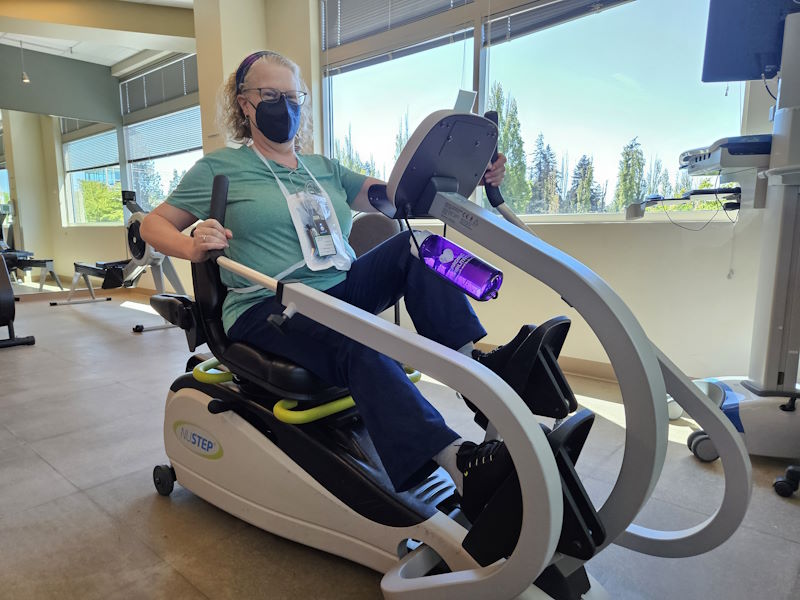 Cindy uses an exercise machine.