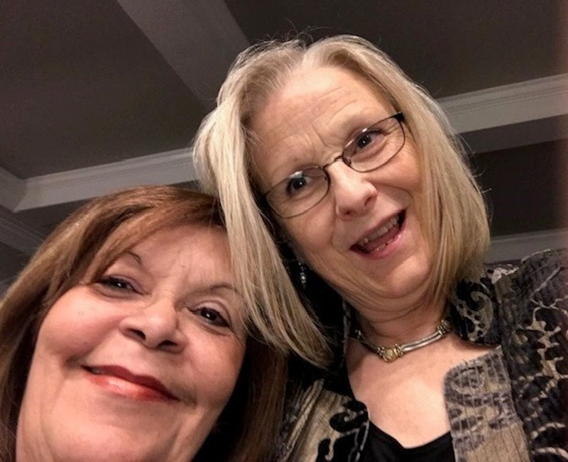 Catherine and her daughter-in-law’s mother smile as they take a selfie together.