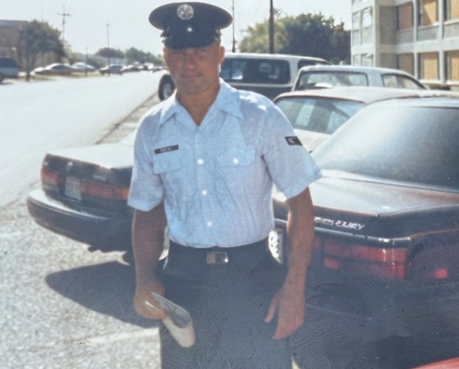 A man wearing a military service uniform.
