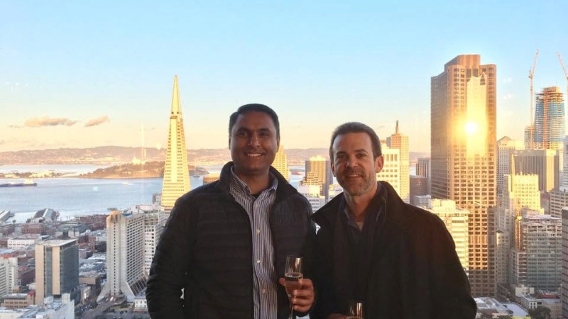 Kevin and Anurag Dhingra together with the San Francisco skyline in the background.